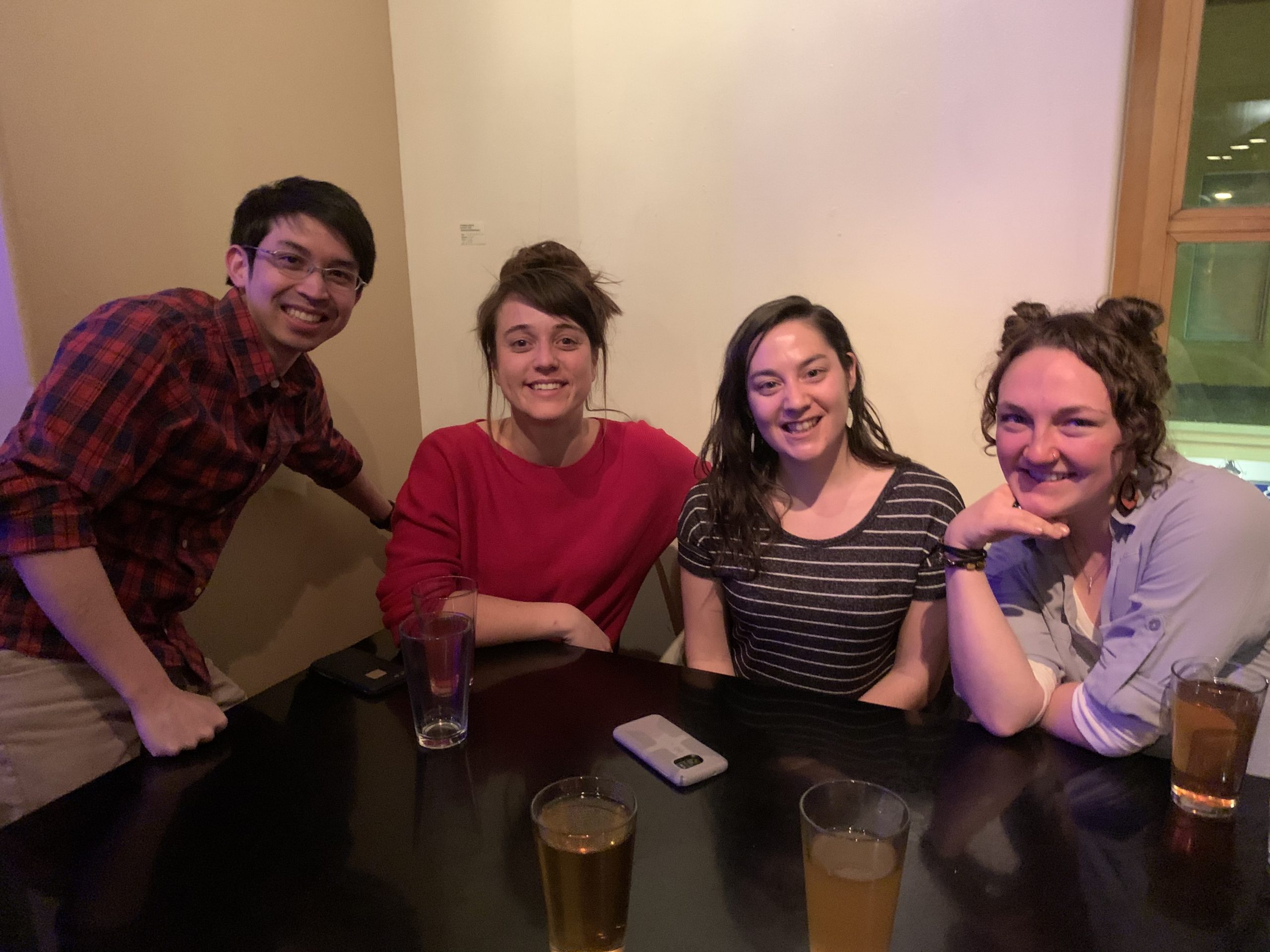 Blum lab member group photo at a bar in Santa Fe