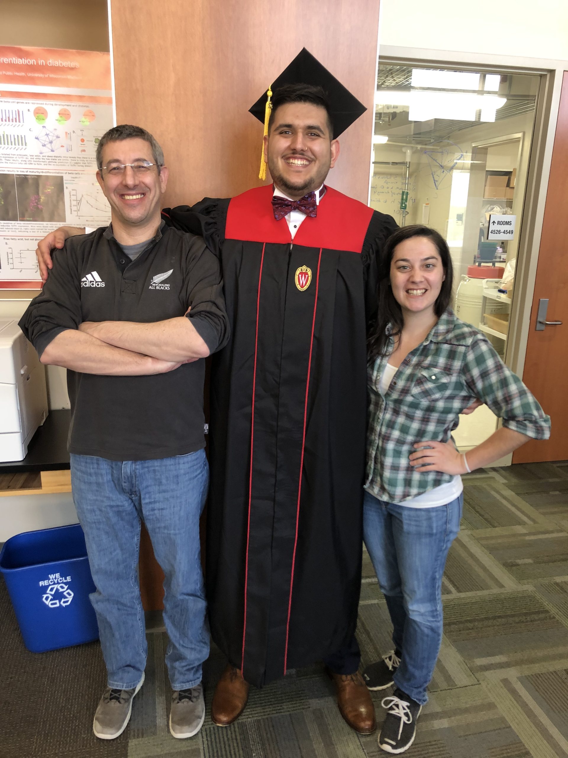 Cyrus' graduation photo with Jen and Barak