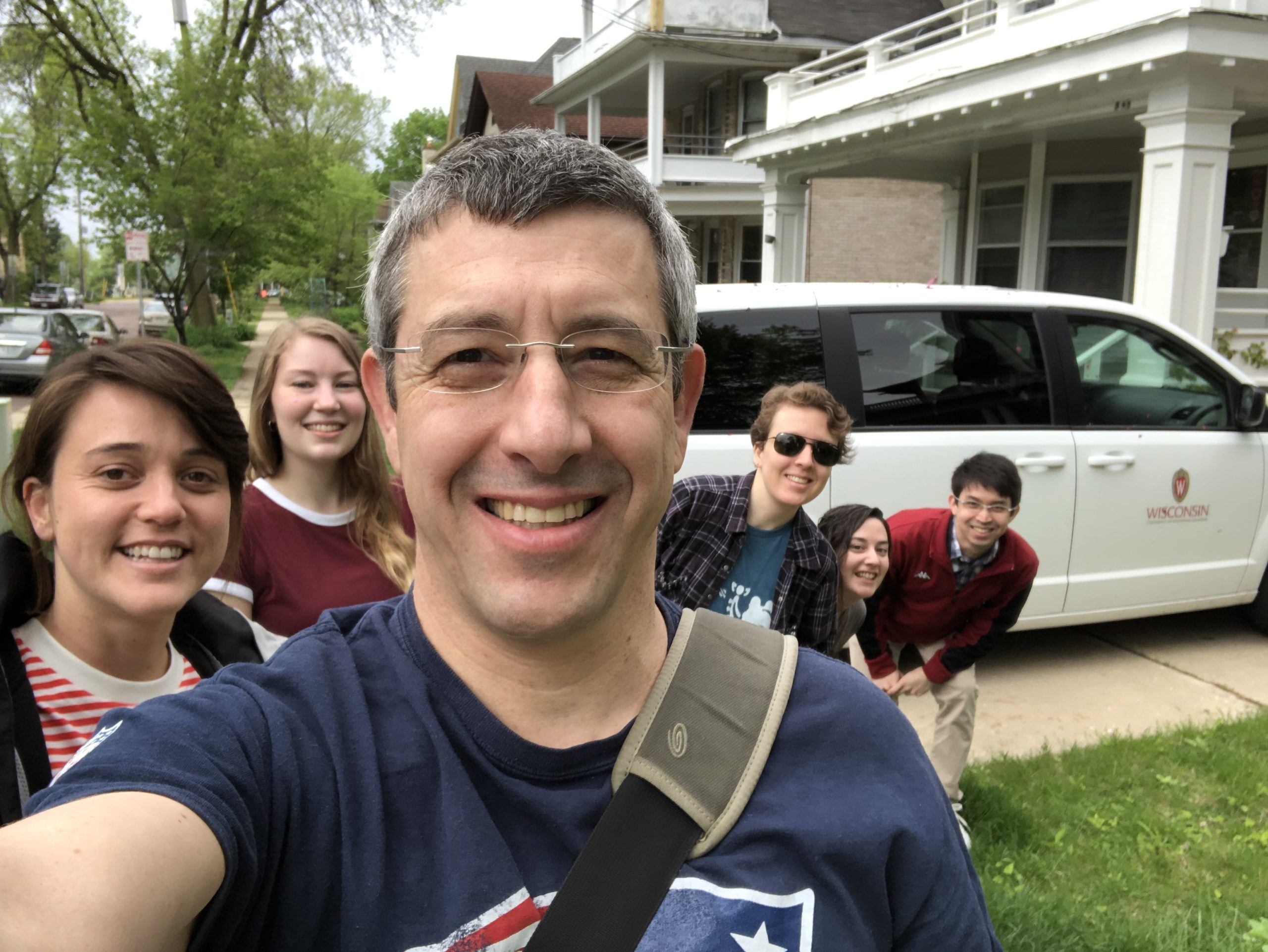 Lab photo in front of a car before driving to 2019 MIC