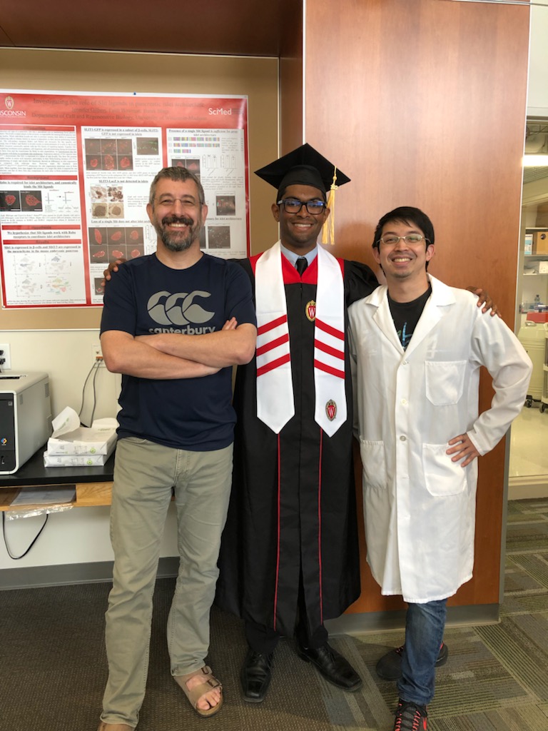 Hari's graduation photo with Dex and Barak