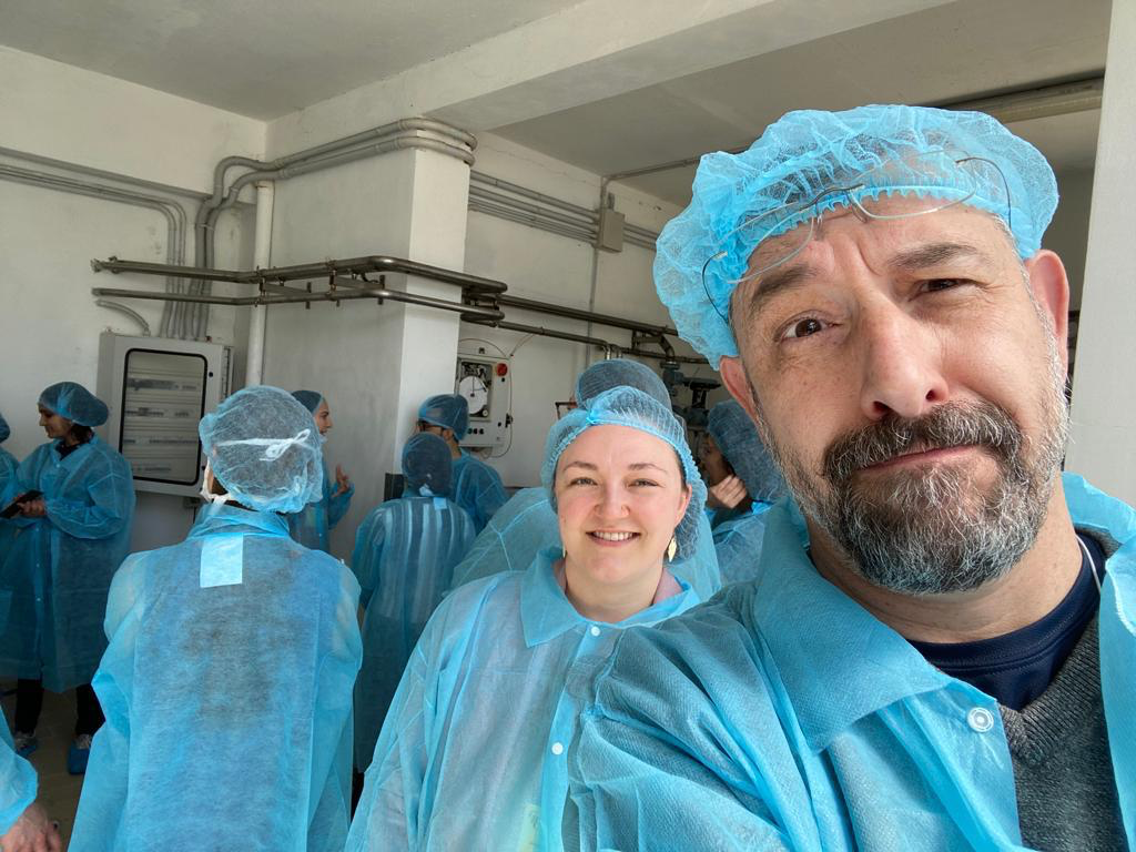 Bayley and Barak at cheese making factory in Lucca, Italy