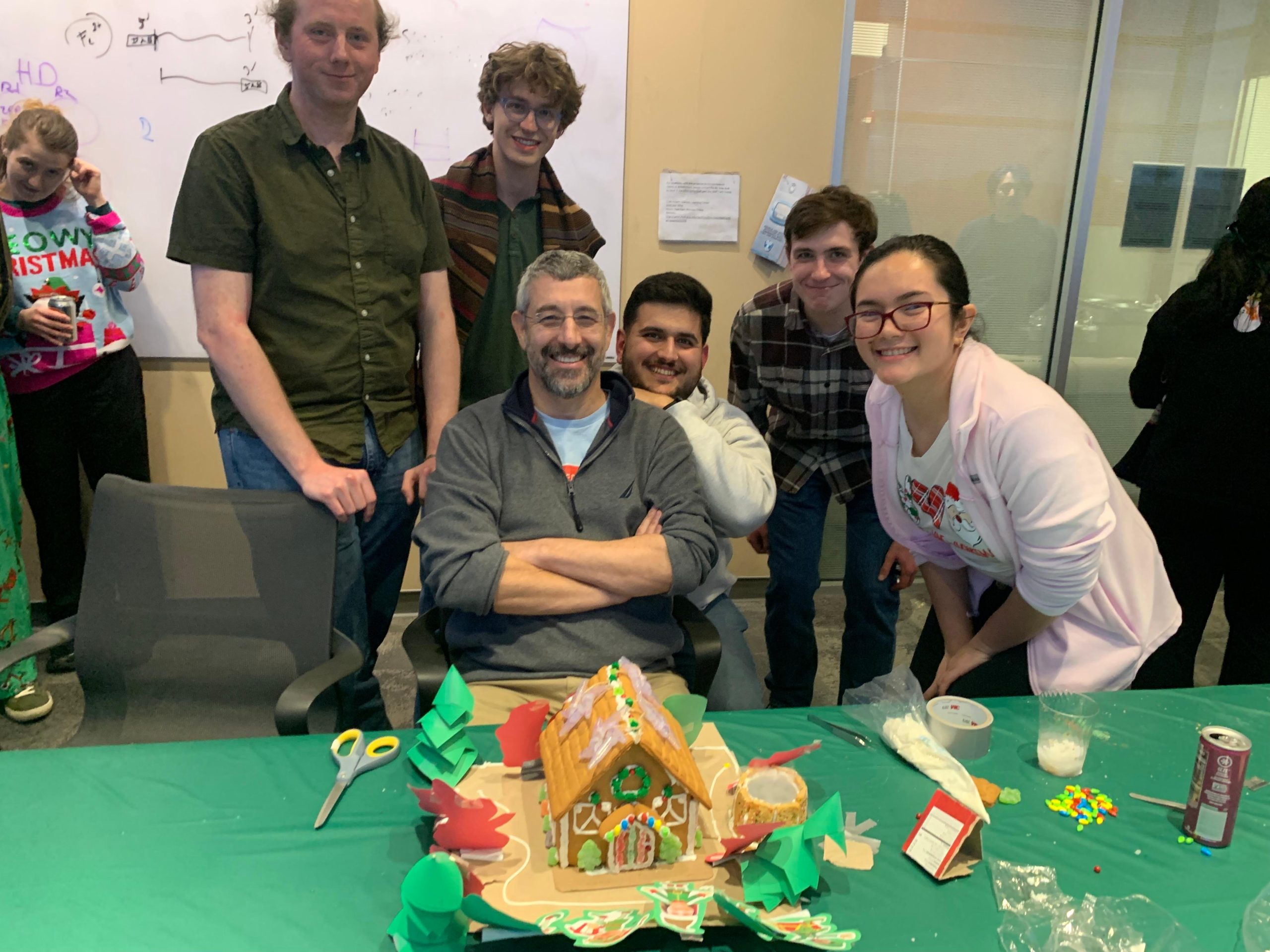 Lab behind gingerbread house for gingerbread house competition in December 2024