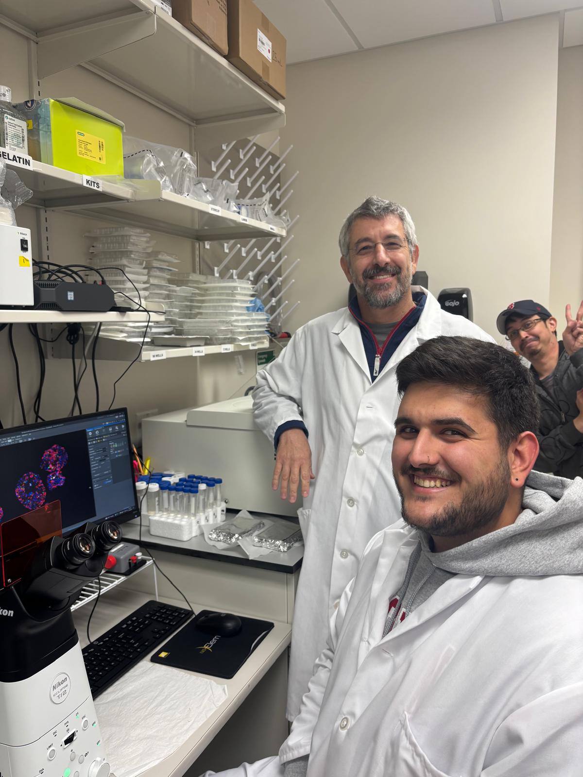 Barak and Cyrus looking at isolated islets of Langerhans being photobombed by Dex sometime in 2024