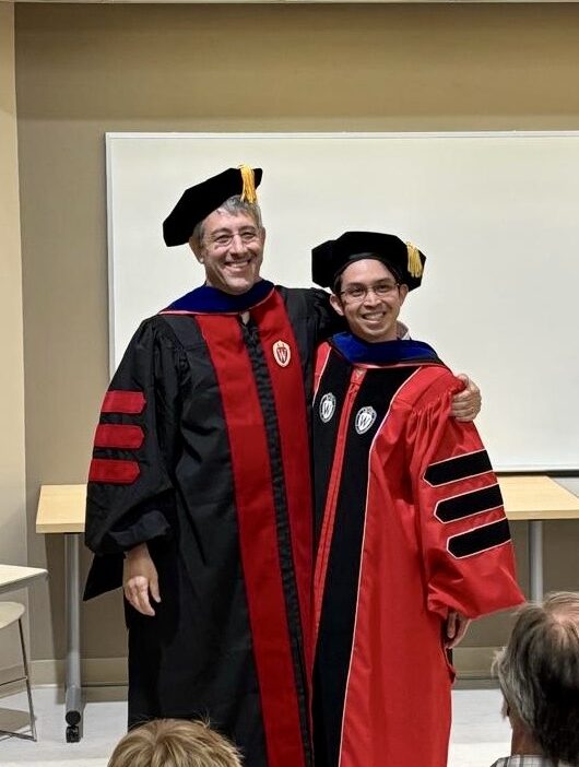 Barak embracing Dex at Dex's PhD graduation ceremony on May 9th, 2025