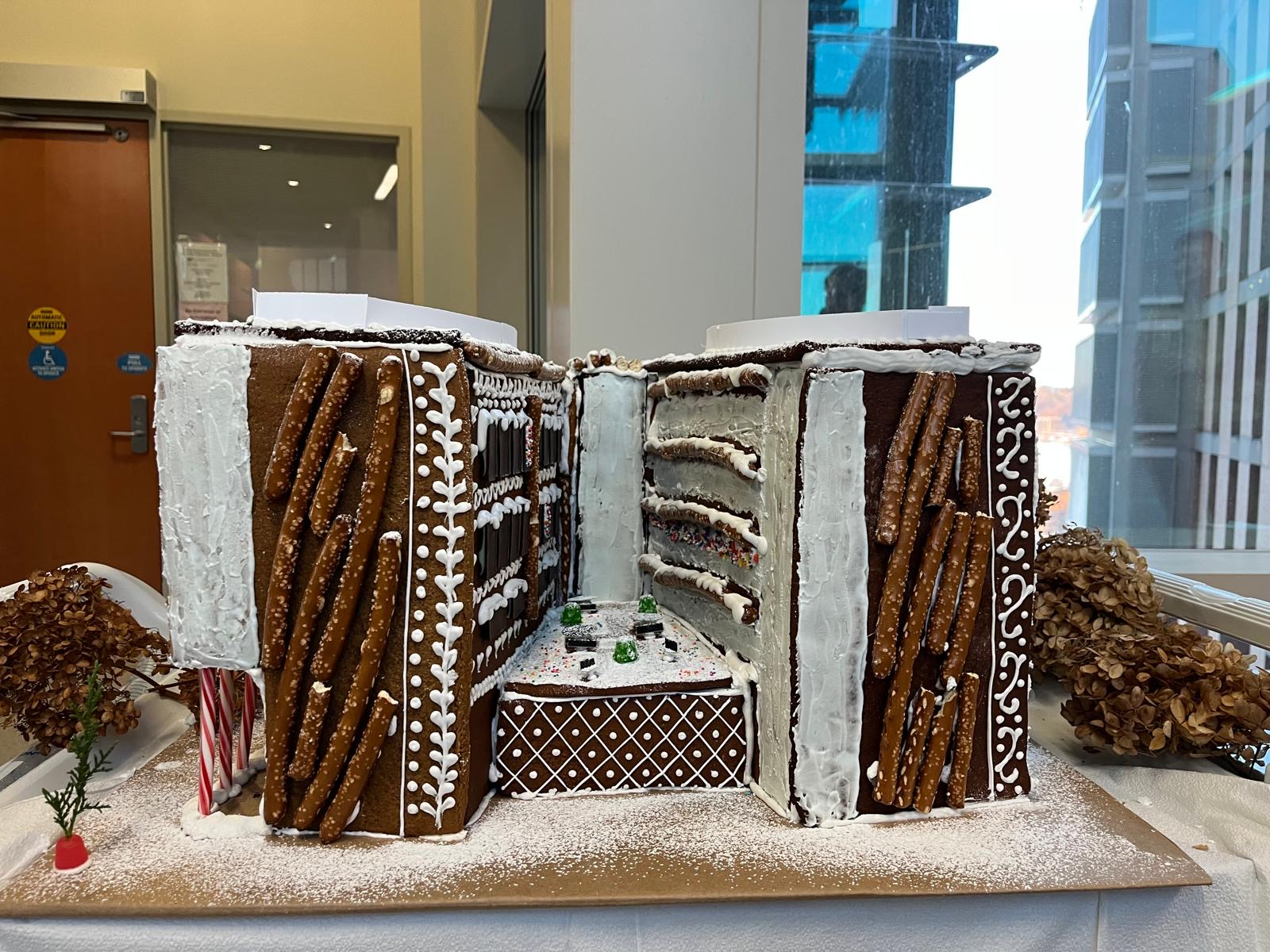 A giant gingerbread house replicating WIMR1 and WIMR2, as well as the wedge connecting them. Of note, the lights are on in the 4th floor windows of CRB.