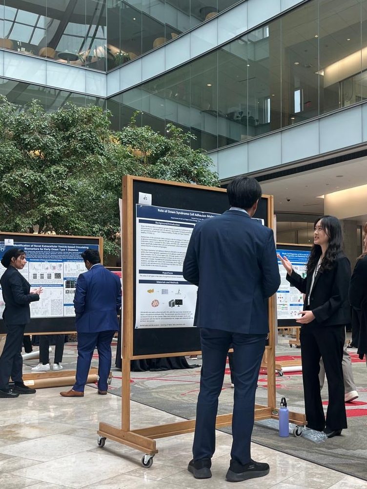 High school researcher Hannah presenting her work at the Midwest islet club meeting in May, 2026